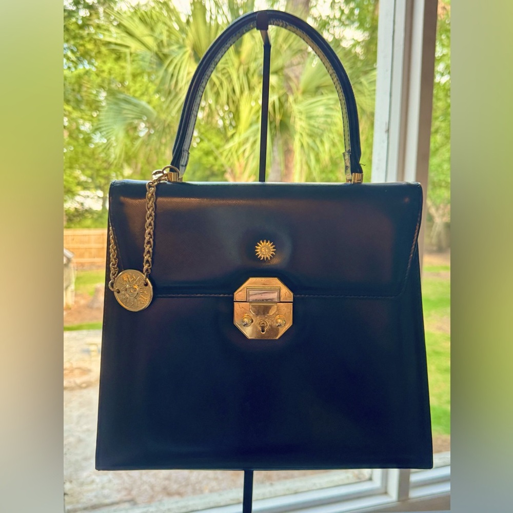 Sold! VERSACE Vintage classic. Black MEDALLION bag w gold hardware. A STEAL.
